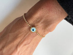 Pulseira bolinhas olho grego